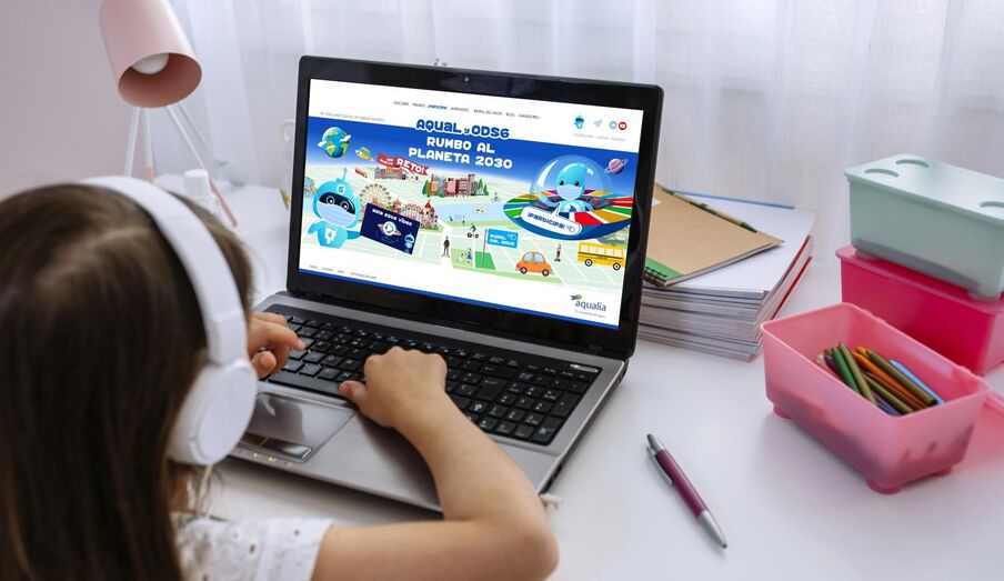 Laptop of a girl with teacher teaching class via videoconference